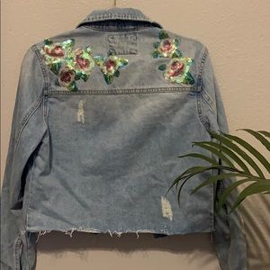 Denim jacket with floral sequin design on back